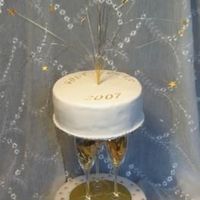 Happy New Year the top cake is chocolate with caramel cream filling, the bottom is tiramisu cake. Happy new year to everyone on CC. Homemade separator.