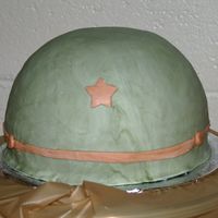 Army Helmet Cake was half of ball pan, with fondant icing. Design inspired by other fabulous helmets here on CC.