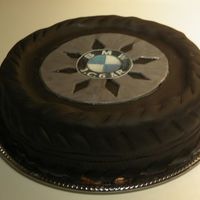 Tire chocolate cake with chocolate bc and fondant, printed edible image