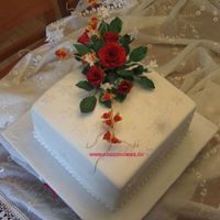 Roses And Snowflakes here is the cake with the bouqet on it