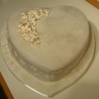 Heart With Flowers just practicing, the cake is a little dark because there is chocolate creme under the fondant