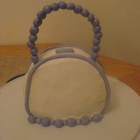 Purse Cake My 1st attempt at a purse cake. It was harder than I thought it would be. I didnt have any fondant made, so my next attempt will be with...