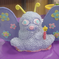 Butterfly Butterfly buttercream cake with fondant wings and accents.