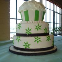 Rachel's Cupcake 3 tier fondant cake with giant cupcake top. This was made for a bride whos obsessed with cupcakes!!