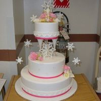 Winter Whimsey Winter themed 3 tier fondant covered cake, gumpaste flowers, with string work.