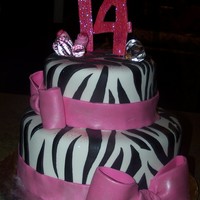 14Th Birthday zebra print with pink fondant bows.