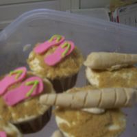 Summertime Cupcakes Carrot cake with white chocolate cream cheese icing and fondant decorations.