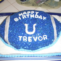 Colts Football Red velvet football with marshmallow treat covering. Sitting on a spice cake with bc frosting