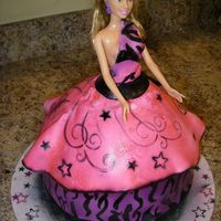 Punk Rock Barbie Doll Cake Punk Rock Barbie cake done in fondant hand painted zebra print then airbrush on everything else. 1st time doing a barbie cake i used a...