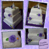 Purple Blossoms All chocolate cake iced and filled with buttercream and then covered in fondant. I made the flowers with fondant/gumpaste.