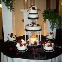 Black And White With Red Roses This is a wedding cake I did for my brother. The roses are real flowers.