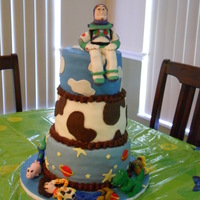 Toy Story 3 layer chocolate cake. covered in fondant. all characters handmade with gumpaste/fondant mixture.