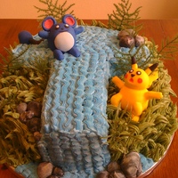 Pokemon Received a request for a pokemon rainforest themed cake and decided to do a chocolate cake covered in colored buttercream frosting. Pikachu...