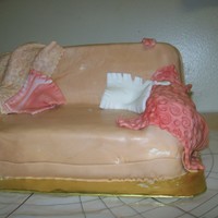 Please Have A Seat yellow cake covered with fondant, with pillows and throws