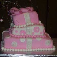 Sweet 16 1st attempt of a topsy turvy . a little turvy. three tier cake covered with lemmon butter flavor fondant. top tier is strawberry , middle...