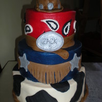Cowboy Themed Cake Made this three tiered cake for boys birthday. Hat on top was small cake.