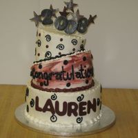 Lauren's Graduation Cake With a topsy turvy look, the stars and numbers are made of fondant.