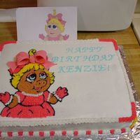 Miss Piggy Birthday Cake This was for my niece's 1st birthday. I used piping gel to transfer a pic I found. Her bow is fondant.