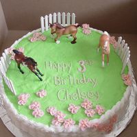 Horse Pasture Birthday Buttercream with plastic Breyer horses and fence. Basket work on the sides with buttercream apple blossoms.