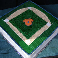 Baseball Field orange flavor cake, filled with mango jelly, cream cheese icing.