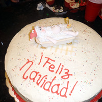 Santas Bath chocolate cake filled with ferrero rocher creme, and philadelphia frosting.Santa is made of gumpaste and fondant