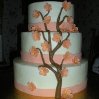 Peach Blossoms? The bride's colors were peach, brown, and gold. I decided to do a cherry blossom look with her colors.