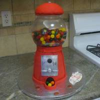 Gumball Machine Cake Plastic fishbowl filled with candies. Covered in fondant. The pennies were molded fondant painted copper from my own mold. Such fun to do...