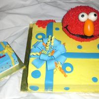 Elmo & Gift Box W/ Smash Lots of cake here ! 14 in sq( cut down some. used trimmings to make smash cake) and ball pan for Elmo. 1st GP bow, streamers and fondant...