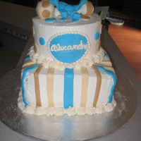Baby Shower Cake With Rattle Two tiered baby shower cake with raffle and fondant accents