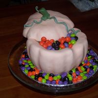 Halloween M&m 3-D Pumpkin Devil's food, vanilla buttercream. Covered in MMF filled with Halloween M&M's regular and peanut butter.