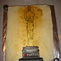 Oscar Party Cake A red velvet cake (representing the red carpet) with cream cheese frosting. Topped with a hand decorated Oscar statue.