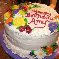 Birthday Cake Amaretto Cake with Amaretto custard filling, whipped cream icing, royal decorations
