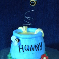 Pooh's Hunny Pot Smash Cake This was a smash cake that matched a first birthday cake done for a friend's son. Pot was iced in buttercream, bees were fondant and...