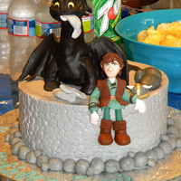How To Train Your Dragon - Elijah Style This was my son's 6th birthday cake. Had cupcakes with little Viking hats to match the cake.