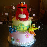 Elmo First birthday cake for a friend's daughter. All buttercream cake with fondant accents and sugarpaste figures.