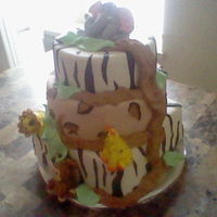 Jungle Friends chocolate, coconut and vanilla cake flavor with buttercream filling and marshmallow fondant all edible.