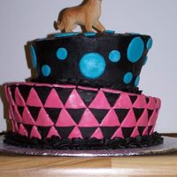 2Nd Cake Attempt This was for my niece's 8th birthday. She just got a dog, and therefore wanted a dog on top - he looks so out of place! The...