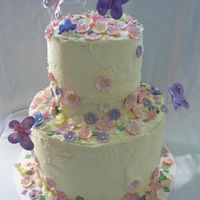 Havana1.jpg Two tier cake with butterflies and buttercups.