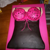 Lingerie Shower 11X15 cake carved down to give hour glass shape. skin colored buttercream black and pink fondant nightie. impression used to get design on...