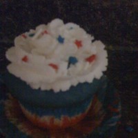 4Th Of July Cupcakes Layered red, white & blue cake batter before baking. Topped with 1M buttercream and star sprinkles.