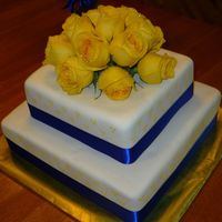 Yellow And Blue Wedding Cake This is a wedding cake I made for my friend. It was done with marshmallow fondant.