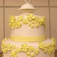 2-Tiered Flower Cake Buttercream covered in fondant, with royal icing flowers and a pastillage topper. Based on a cake by Peggy Porschen.