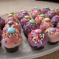 Cupcake Bites Cake balls covered in chocolate made to look like mini cupcakes. Inspired by Bakerella.com