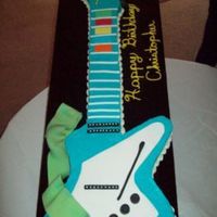 Guitar Hero Birthday Cake This cake was over 3 feet long. It was a combination vanilla BC with fondant accents