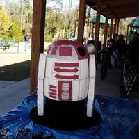 R4G9 I was corrected when I called this R2D2. Iced in Buttercream, decorations in fondant and legs out of rice crispie treats.