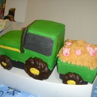 John Deere John Deere tractor, trailer with gumpaste pigs