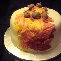 Fondant_Fall4.jpg Covered with MM fondant and MM fondant leaves. Acorns with gumpaste