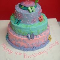 Tinker Belle 3-teir yellow cake with whipped icing. I wanted this to be like a mini wedding cake for my neice. Each layer is a different color and each...