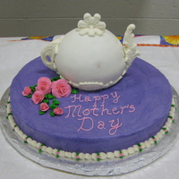 Mother's Day Teapot Cake I made this for a Mother's Day tea party at my preschool. The decorations on the teapot are MM fondant pressed into candy molds and...