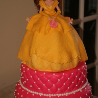 Belle Birthday Cake Belle is made with rice crispy treats covered with MMF. The dress looks better with the texture. I found a small rubber texture mold in the...